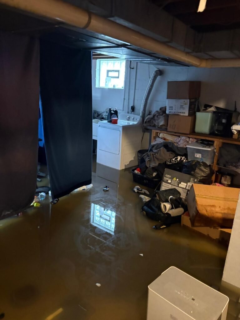 Flooded basement with standing water discovered during a home inspection in Northern Kentucky